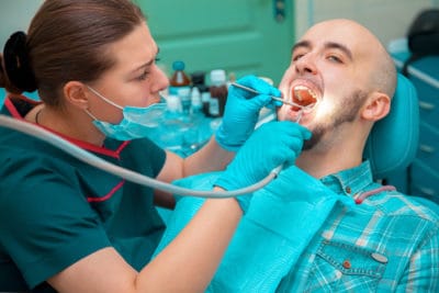 man getting dental cleaning