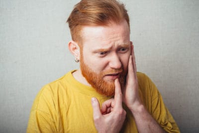 man with toothache