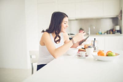 healthy woman eats breakfast